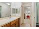The bathroom features a single vanity, and neutral colors with an attached bedroom at 464 Lake Suzanne Dr, Lake Wales, FL 33859