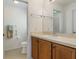 The bathroom features a single vanity, and neutral colors at 464 Lake Suzanne Dr, Lake Wales, FL 33859