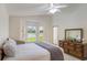 Bright bedroom boasts neutral colors, vaulted ceilings, and lots of natural light with a view at 464 Lake Suzanne Dr, Lake Wales, FL 33859
