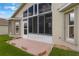 Home exterior featuring a screened lanai, a patio, and well-maintained landscaping at 464 Lake Suzanne Dr, Lake Wales, FL 33859