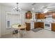 Charming kitchen features wood cabinets, white appliances, and a bright dining nook with natural light at 464 Lake Suzanne Dr, Lake Wales, FL 33859
