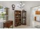 Cozy living area with display cabinet, bookshelf, and bright windows with natural light at 464 Lake Suzanne Dr, Lake Wales, FL 33859