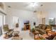 Spacious living room with a large window, plush seating, and ample natural light at 464 Lake Suzanne Dr, Lake Wales, FL 33859
