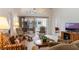 Inviting living room with a lake view, comfortable seating, and natural light at 464 Lake Suzanne Dr, Lake Wales, FL 33859