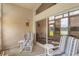 Relaxing enclosed patio with comfortable seating and serene lake views at 464 Lake Suzanne Dr, Lake Wales, FL 33859