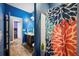 The bathroom features blue walls, wood floors, and a shower/tub combo at 4662 Osprey Way, Winter Haven, FL 33881