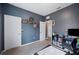 Cozy bedroom featuring dark gray walls, carpet flooring, and a small window at 4662 Osprey Way, Winter Haven, FL 33881