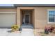 Close-up of a welcoming front entrance with a simple black front door at 4662 Osprey Way, Winter Haven, FL 33881