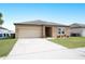Charming single-story home with a well-manicured lawn and welcoming curb appeal at 4662 Osprey Way, Winter Haven, FL 33881