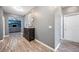 The hallway features a dark wood floor, gray walls, and an ornate decorative piece at 4662 Osprey Way, Winter Haven, FL 33881
