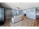 Cozy living room with a comfortable sectional and elegant hardwood floors at 4662 Osprey Way, Winter Haven, FL 33881