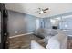 Comfortable living room featuring a sectional sofa, ceiling fan, and stylish decor at 4662 Osprey Way, Winter Haven, FL 33881