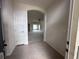 Entryway revealing a hallway, arched entrance and access to a spacious living area at 4747 Mandolin Loop, Winter Haven, FL 33884