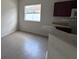 Corner of the kitchen, with wood cabinets, laminate countertops, and view of a sunny window at 4747 Mandolin Loop, Winter Haven, FL 33884