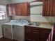 Well-equipped laundry room features newer washer, dryer, sink, and cabinet storage at 514 7Th S St, Dundee, FL 33838