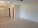 Open living room with tile floors, neutral walls, and a ceiling fan, great for relaxing or entertaining guests at 514 7Th S St, Dundee, FL 33838