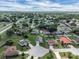 Expansive aerial view of a suburban neighborhood featuring well-maintained homes and lush green landscapes at 5424 Moon Valley Dr, Lakeland, FL 33812