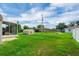 Large backyard with a storage shed, patio and green grass, ideal for outdoor activities at 5424 Moon Valley Dr, Lakeland, FL 33812