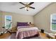 Bedroom with a ceiling fan, natural light and an exercise bike at 5424 Moon Valley Dr, Lakeland, FL 33812
