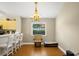 Dining area with modern chandelier and views of the backyard at 5424 Moon Valley Dr, Lakeland, FL 33812