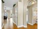 Warm and inviting hallway featuring hardwood floors and arched doorways to other rooms at 5424 Moon Valley Dr, Lakeland, FL 33812