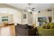 Spacious living room with hardwood flooring, archways, and comfortable seating at 5424 Moon Valley Dr, Lakeland, FL 33812