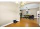 Inviting living room featuring hardwood floors, neutral paint, a ceiling fan, and an archway at 5424 Moon Valley Dr, Lakeland, FL 33812