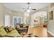 Open concept living room with hardwood flooring and a view of the kitchen at 5424 Moon Valley Dr, Lakeland, FL 33812