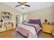 Comfortable bedroom featuring natural lighting, a ceiling fan and a shelf at 5424 Moon Valley Dr, Lakeland, FL 33812