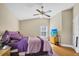 Bedroom with a ceiling fan, tv and natural light at 5424 Moon Valley Dr, Lakeland, FL 33812