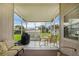 Enclosed patio with neutral furniture, an outdoor grill, and views of the backyard at 5424 Moon Valley Dr, Lakeland, FL 33812