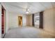 Bedroom with view into kitchen; includes a closet and large window at 6027 Grand Oaks Se Dr, Winter Haven, FL 33884