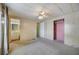 Bedroom features a ceiling fan and built in closet with attached bathroom at 6027 Grand Oaks Se Dr, Winter Haven, FL 33884