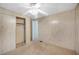 Bedroom featuring built-in closet and a ceiling fan at 6027 Grand Oaks Se Dr, Winter Haven, FL 33884