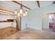 Open concept dining area showcasing the kitchen and easy access to the living room and bathroom at 6027 Grand Oaks Se Dr, Winter Haven, FL 33884