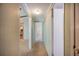 Hallway view with access to the kitchen and bedrooms at 6027 Grand Oaks Se Dr, Winter Haven, FL 33884