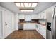 Efficient kitchen featuring ample counter space, modern appliances, and stylish tile flooring throughout at 6027 Grand Oaks Se Dr, Winter Haven, FL 33884