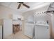 Functional laundry room featuring ample storage, washer, and dryer at 6027 Grand Oaks Se Dr, Winter Haven, FL 33884