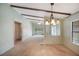 Spacious living room area with bright windows and an open floor plan at 6027 Grand Oaks Se Dr, Winter Haven, FL 33884