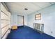 Enclosed porch with blue carpet, white walls, and natural light at 6027 Grand Oaks Se Dr, Winter Haven, FL 33884