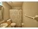 Bathroom features modern fixtures and a shower with decorative curtain at 658 Lake Dexter Cir, Winter Haven, FL 33884