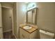 Bathroom with updated vanity, bright lighting, and modern fixtures at 658 Lake Dexter Cir, Winter Haven, FL 33884
