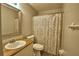 Bathroom featuring a wood countertop vanity and decorative shower curtain at 658 Lake Dexter Cir, Winter Haven, FL 33884