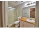Well-maintained bathroom featuring a glass-enclosed shower and a sink with butcher block countertop at 658 Lake Dexter Cir, Winter Haven, FL 33884
