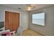 Bedroom with a ceiling fan, natural light, and neutral color scheme at 658 Lake Dexter Cir, Winter Haven, FL 33884
