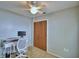 Bedroom features a ceiling fan, workspace, and natural light from window at 658 Lake Dexter Cir, Winter Haven, FL 33884