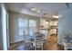Inviting dining area with an abundance of natural light and a view into the kitchen at 658 Lake Dexter Cir, Winter Haven, FL 33884