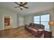 Inviting living room featuring hardwood floors and a large window that provides natural light at 658 Lake Dexter Cir, Winter Haven, FL 33884