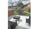 Screened-in balcony with patio furniture and views of the neighborhood at 7906 Waterview Way # 7906, Winter Haven, FL 33884