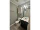Bathroom featuring a vanity, white cabinet, modern fixtures, and neutral tones at 7906 Waterview Way # 7906, Winter Haven, FL 33884